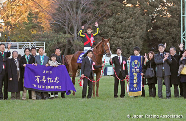 Orfevre and owners Sunday Racing Co. Ltd. in the winner's circle after the 2013 Arima Kinen. Photo: Japan Racing Association.