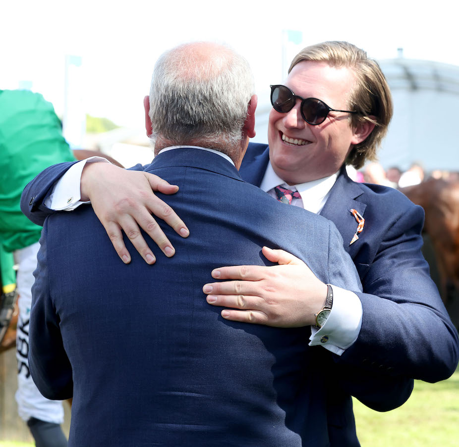 Sam Sangster hugs Isaac Shelby’s trainer Brian Meehan after their Newmarket success. Photo: Dan Abraham / focusonracing.com