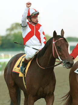 McCarron salutes the New York crowd after Riboletta defeats Beautiful Pleasure in the Beldame. Photo: Coglianese