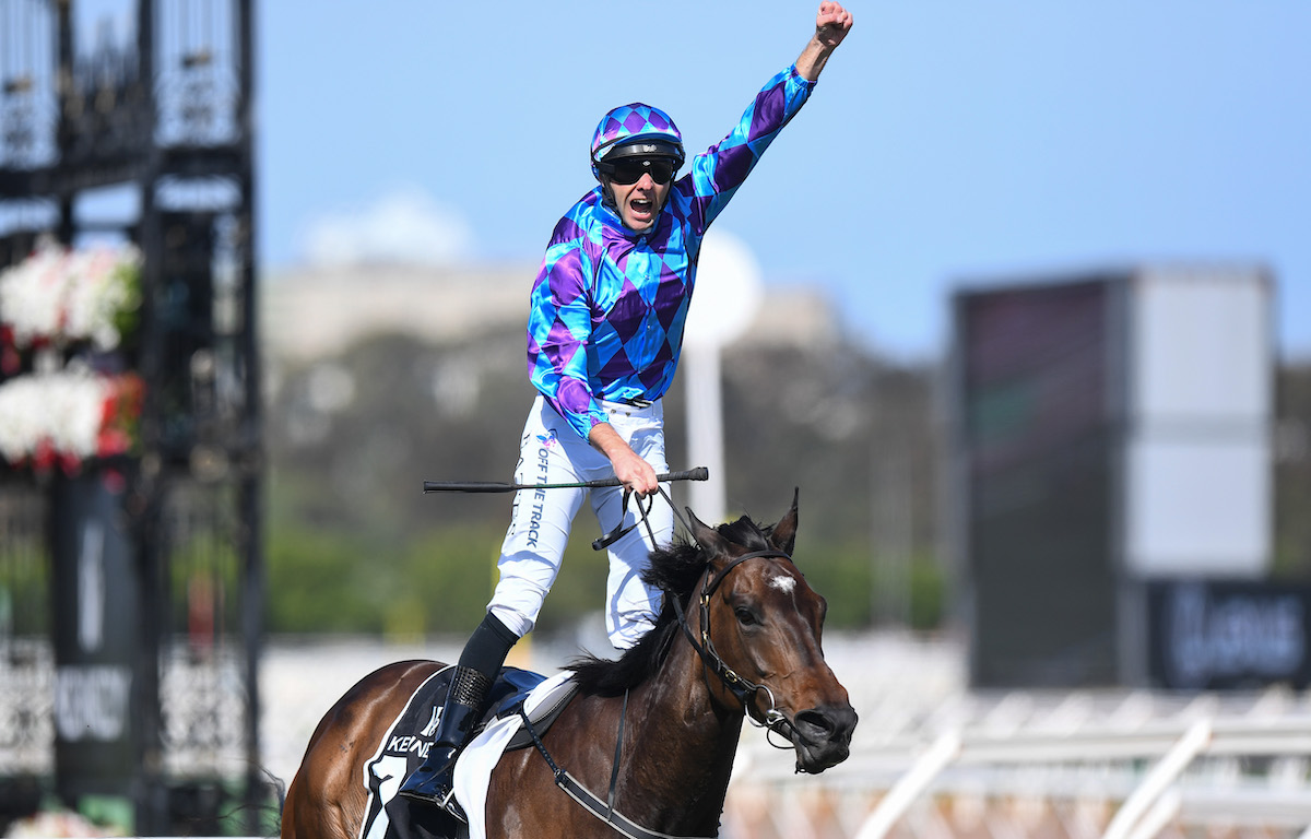 Declan Bates celebrates as Pride Of Jenni wins her second G1 event in the the Kennedy Champions Mile at Flemington in November 2023. Photo Morgan Hancock / Racing Photos