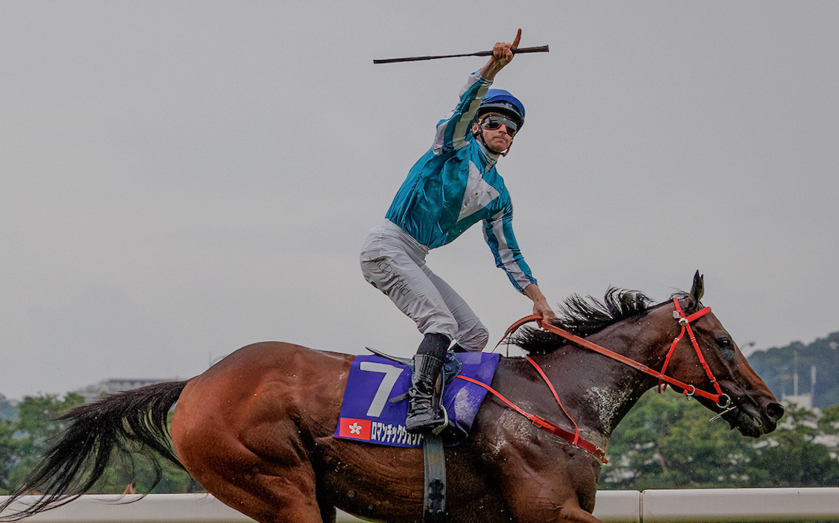 James McDonald in celebratory mood as Romantic Warrior wins the Yasuda Kinen. Photo: HKJC