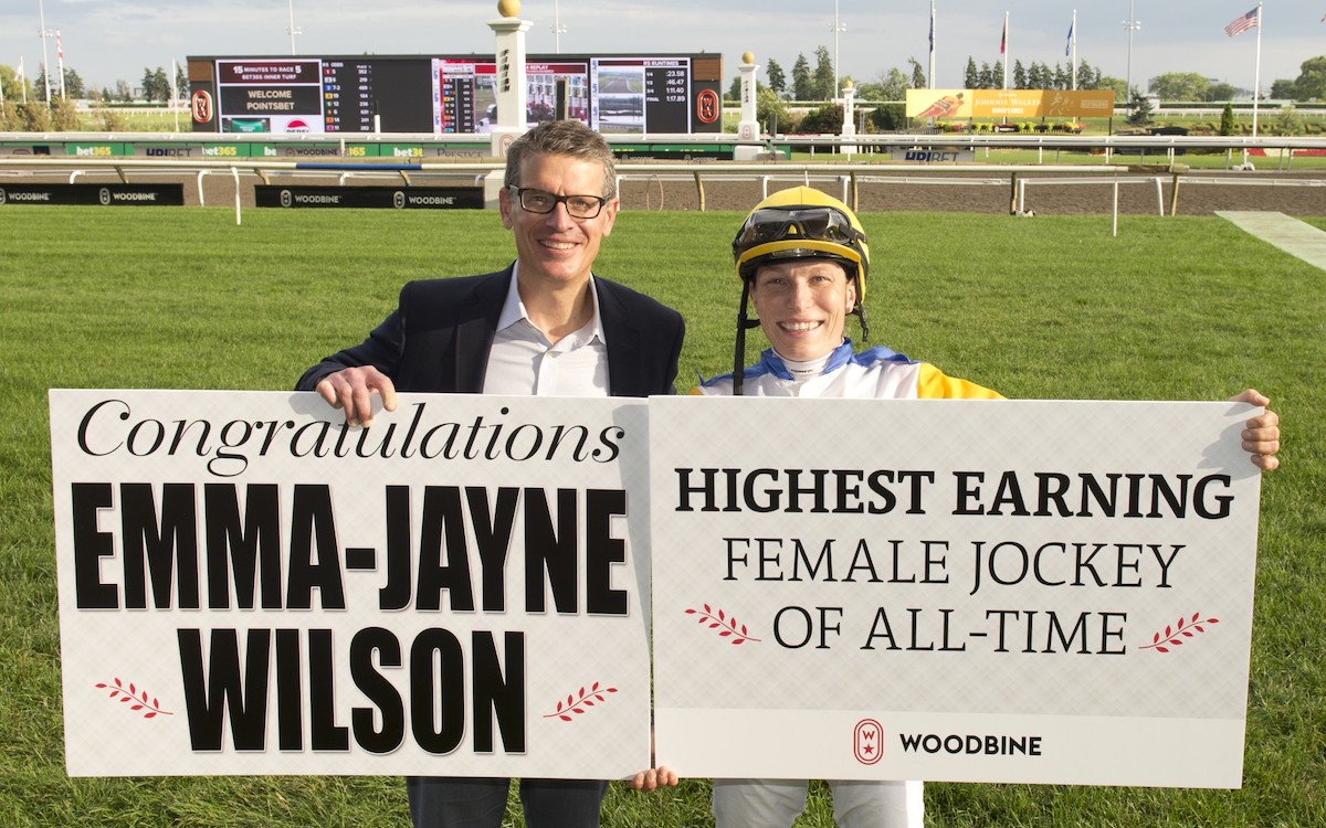 Emma-Jayne Wilson with Woodbine CEO Michael Copeland after breaking the all-time earnings record for a female jockey. Photo: Michael Burns Photography