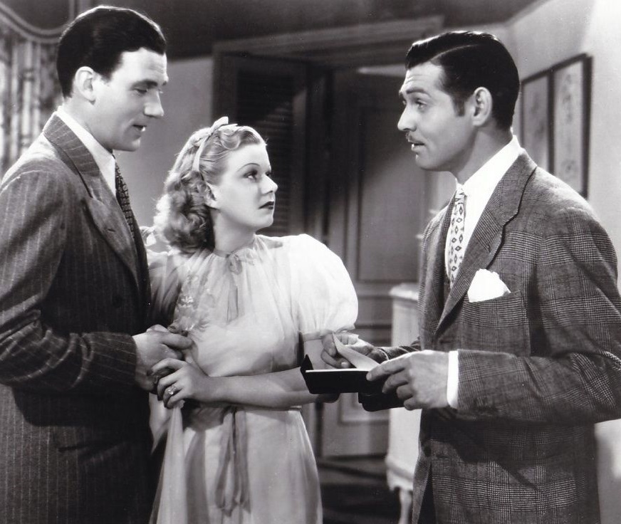 The well-named Walter Pidgeon under attack from hustling bookie Clark Gable while Jean Harlow referees. (MGM photo)