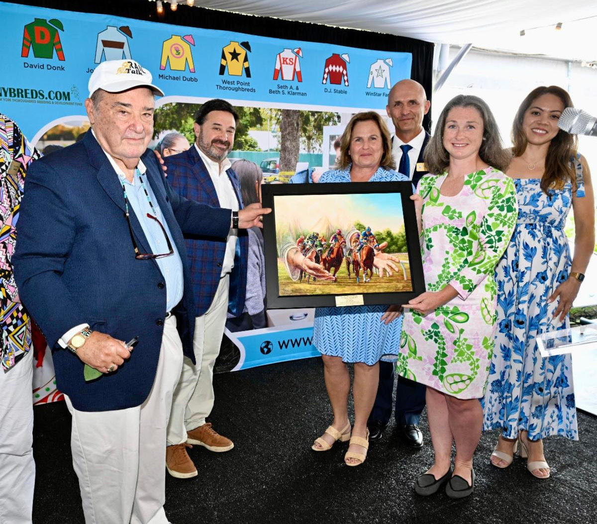 Len Green receices his award for commitment to the backstretch community. Photo courtesy of Skip Dickstein