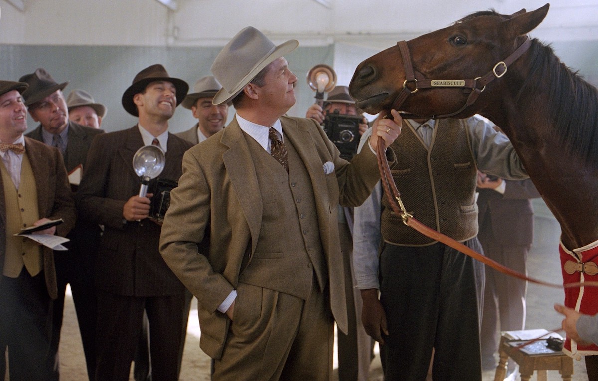 Jeff Bridges, as Charles Howard, admires his bargain champion. (Universal Pictures)