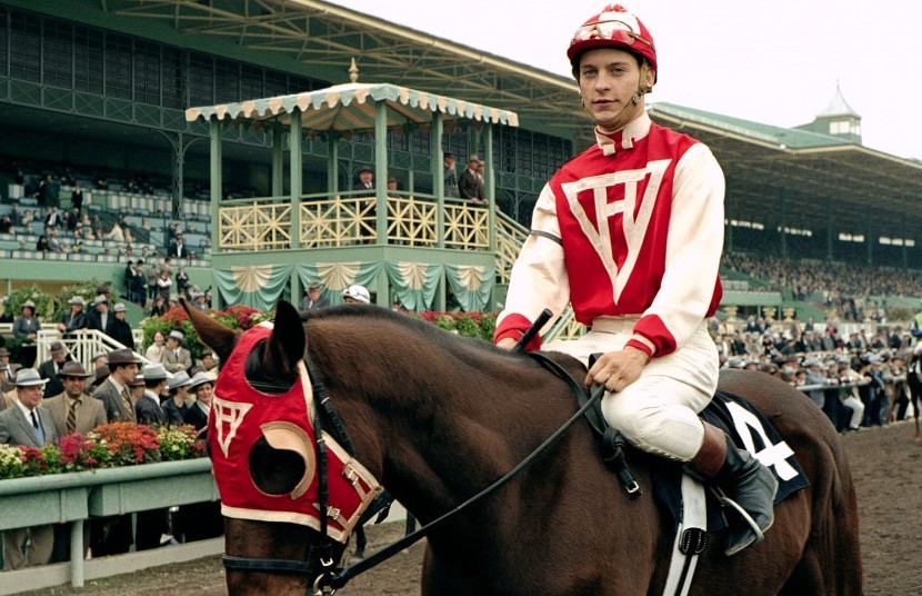 Tobey Maguire goes from Spider-Man to Red Pollard and Seabiscuit's saddle. (Universal Pictures)