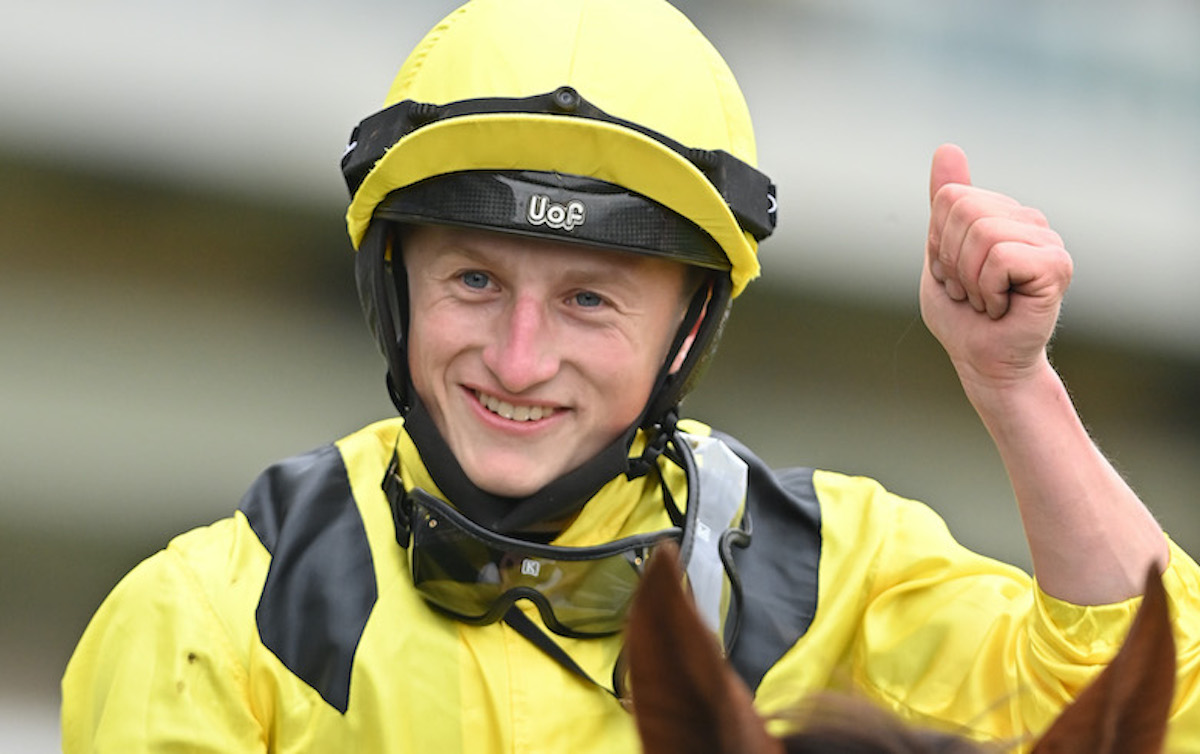 Tom Marquand celebrates after winning the Champion Stakes on Addeybb in 2020. Photo © Hugh Routledge for HKJC