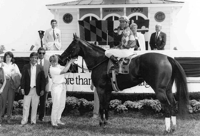 Safely Kept poses with Gary Stevens and 130 pounds up after winning the 1991 Maryland Million Distaff. (Maryland Jockey Club photo)