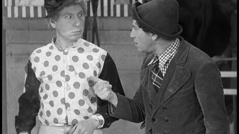 Harpo, as Stuffy the jock, gets encouragement from co-conspirator Chico. (MGM Studio photo)