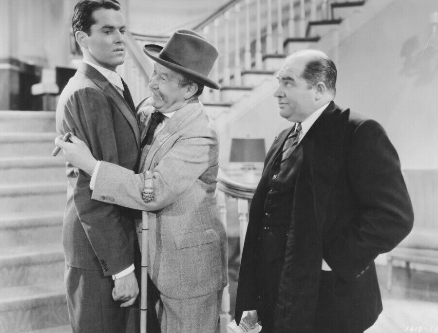 A skeptical Bill (Edward Brophy) watches Col. Barnaby (Spencer Charters) put the squeeze on Towny. (Paramount Pictures photo) 