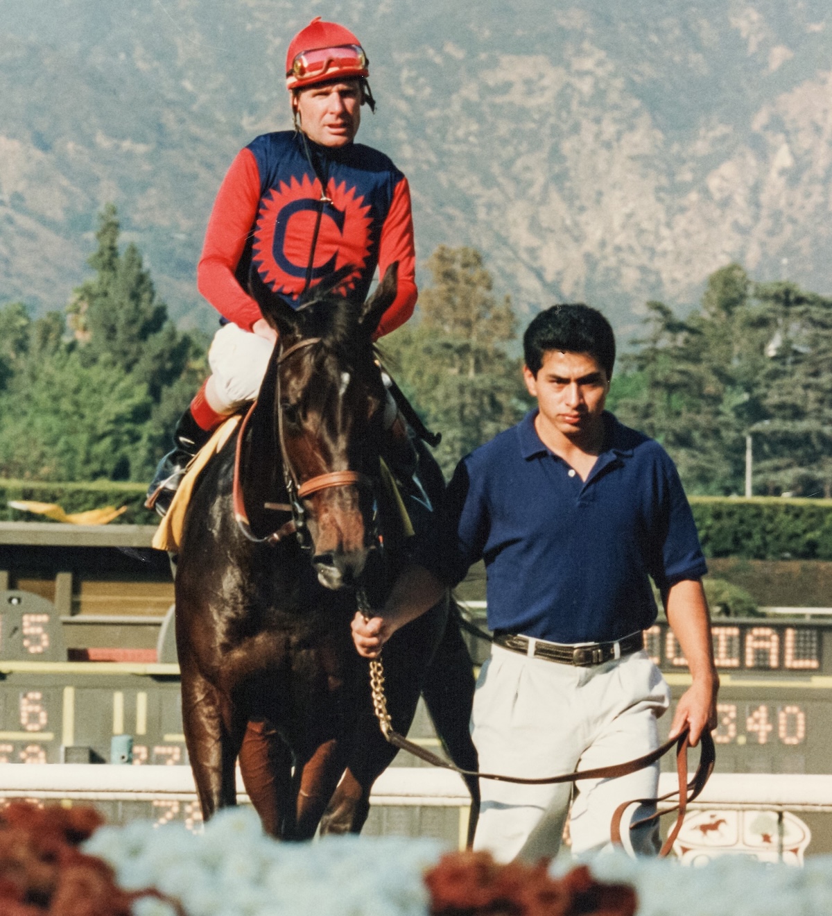 Groom Juan Lopez leads Hollywood Wildcat into the Santa Anita winner’s circle after the 1994 Lady’s Secret, her final triumph. (Benoit photo)