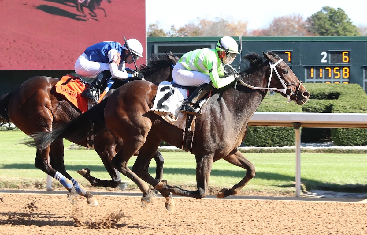 Stretch drive: Tyler Bacon in winning action at Oaklawn, where he stands fifth in the jockey standings. Photo: Coady Media